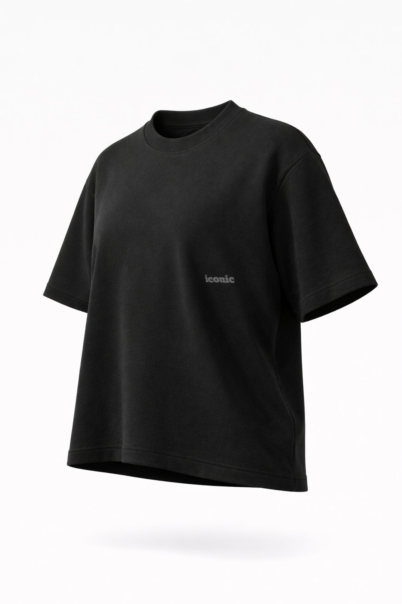 Black crewneck T-shirt with small ‘iconic’ chest print, angled front view.