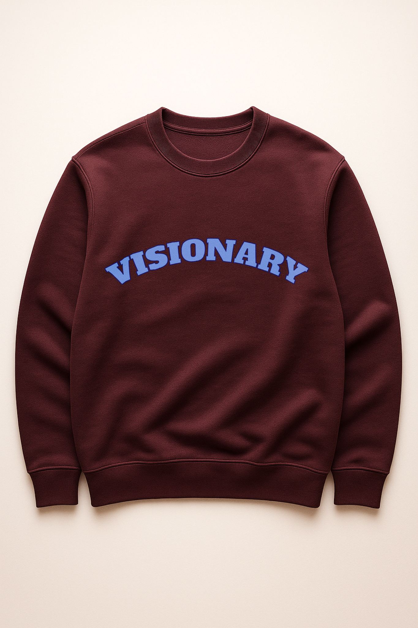 VISIONARY sweatshirt flat lay in burgundy with blue lettering — organic cotton fleece premium crewneck.
