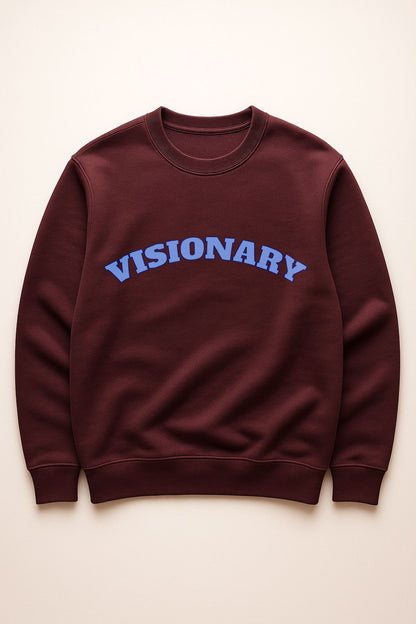 VISIONARY sweatshirt flat lay in burgundy with blue lettering — organic cotton fleece premium crewneck.

