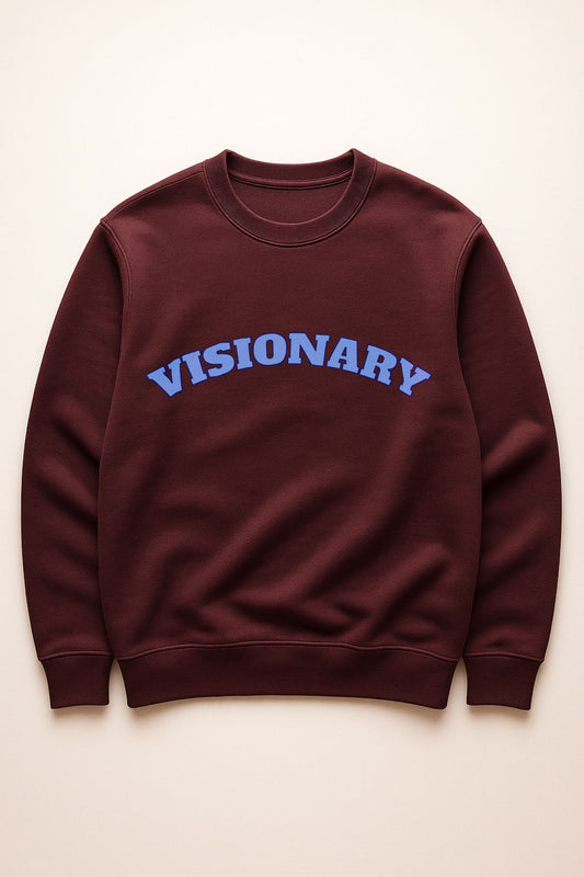 VISIONARY sweatshirt flat lay in burgundy with blue lettering — organic cotton fleece premium crewneck.
