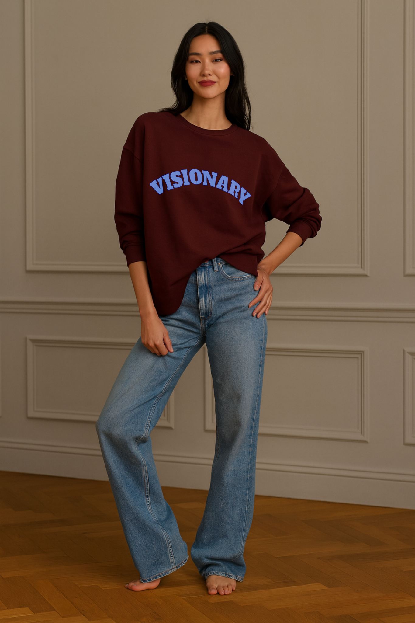 FineAF VISIONARY sweatshirt in burgundy, unisex straight fit crewneck styled with blue text and jeans.