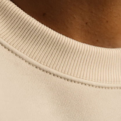 Macro detail of FineAF EMPATH sweatshirt neckline, showcasing smooth collar finish and double-stitched seams