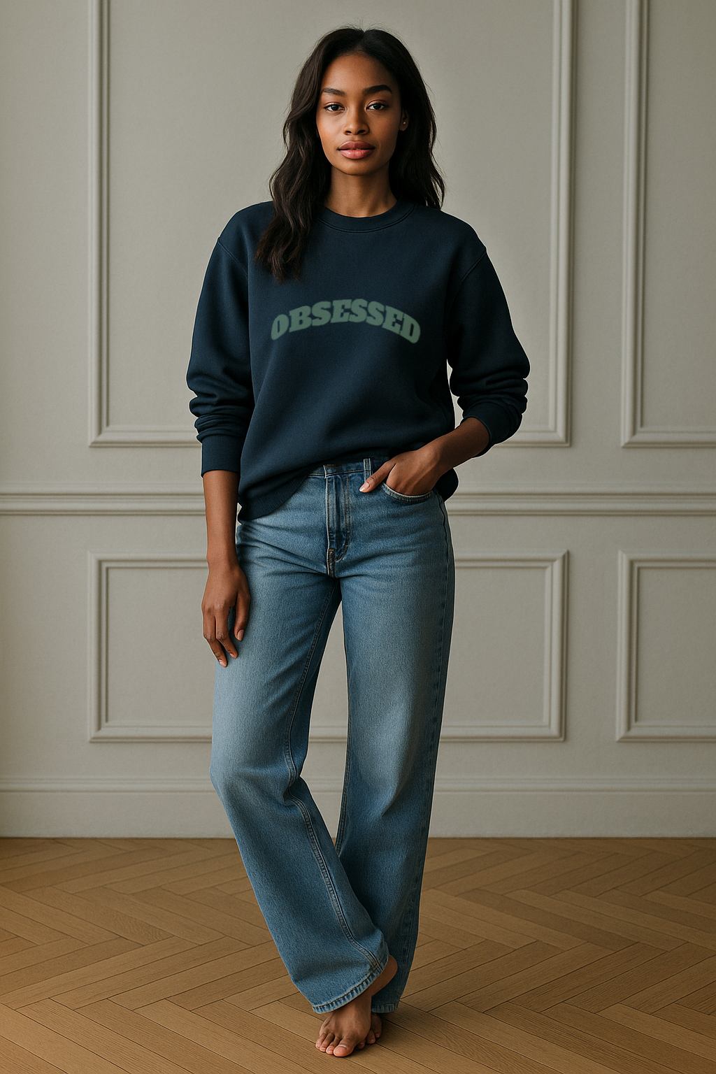 Full-length view of FineAF OBSESSED sweatshirt in blue-teal, styled with light denim jeans.
