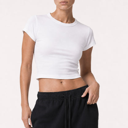 Close on-body view showing the fit and 43.5 cm crop length of the white FineAF Cropped Tee