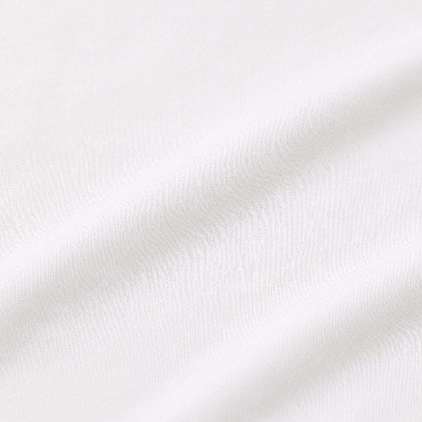 Close-up of the opaque white cotton-elastane jersey used in the FineAF Cropped Tee