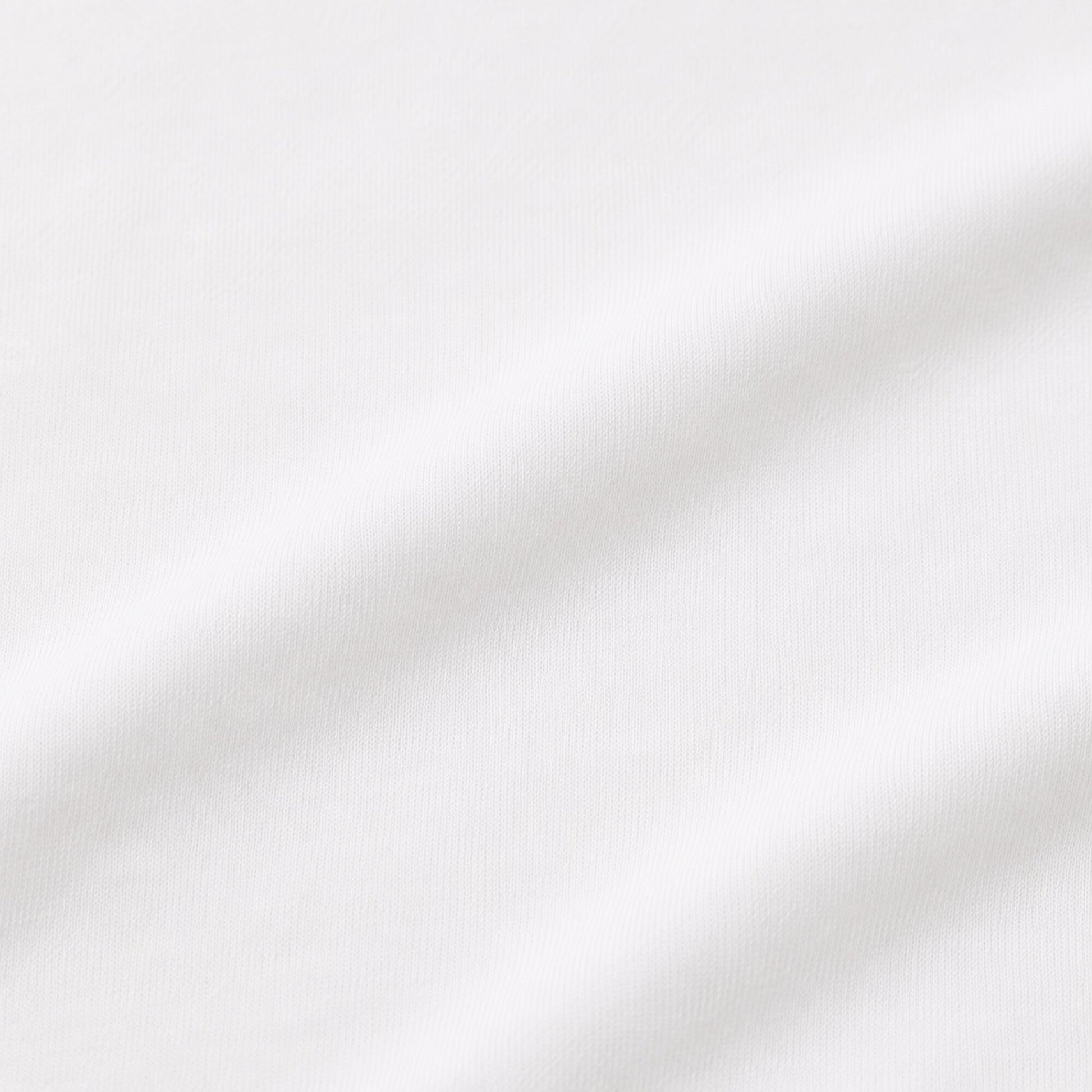 Close-up of the opaque white cotton-elastane jersey used in the FineAF Cropped Tee