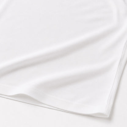Close-up of the white FineAF Cropped Tee hem and side seam construction
