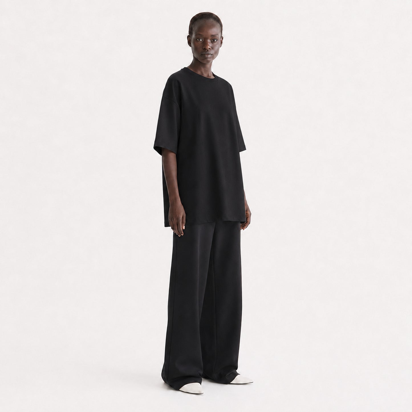 FineAF Collection One heavyweight drop-shoulder T-shirt in Black, three-quarter view on model