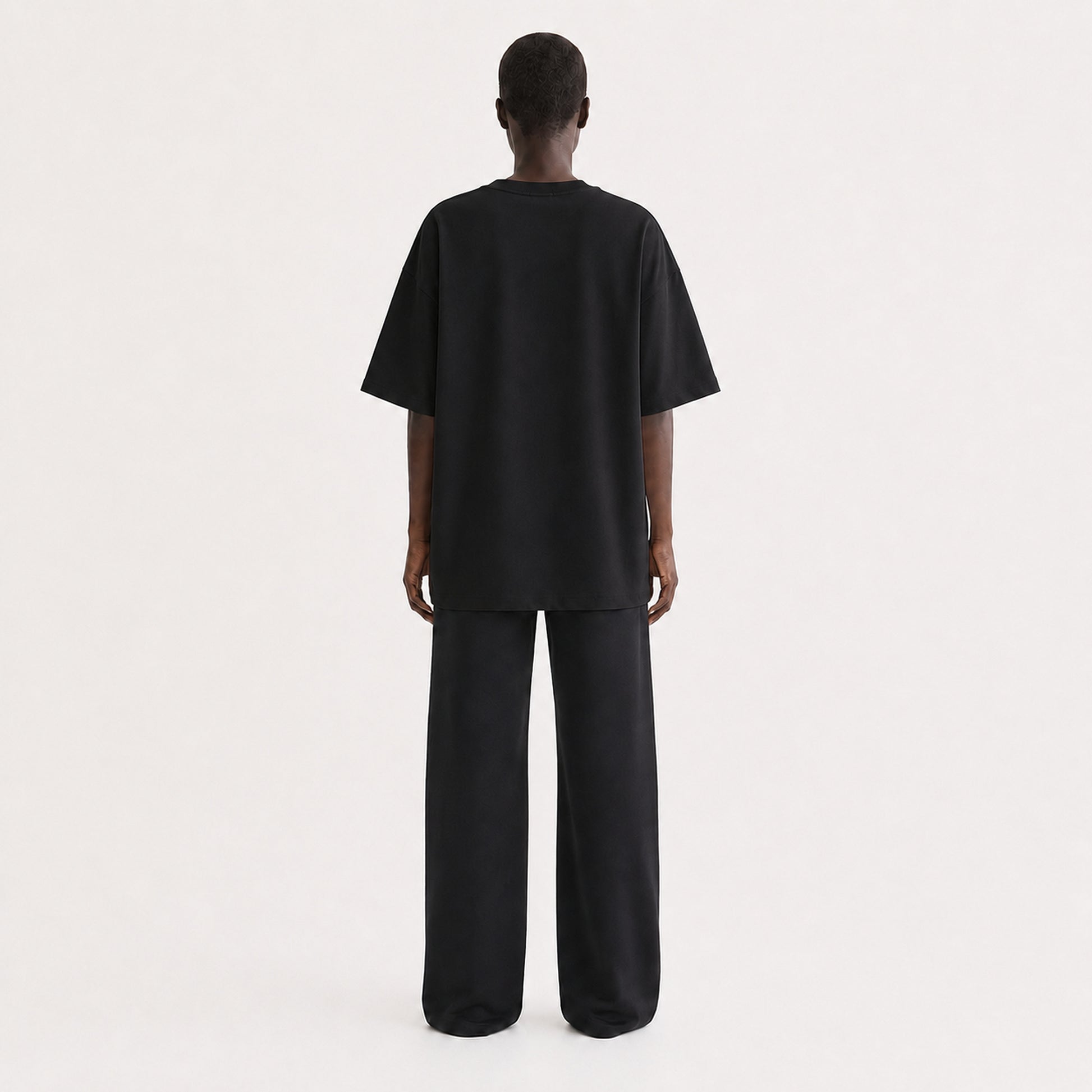 FineAF Collection One heavyweight drop-shoulder T-shirt in Black, back view on model