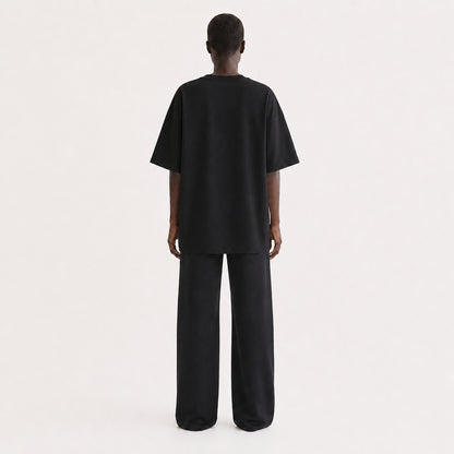 FineAF Collection One heavyweight drop-shoulder T-shirt in Black, back view on model