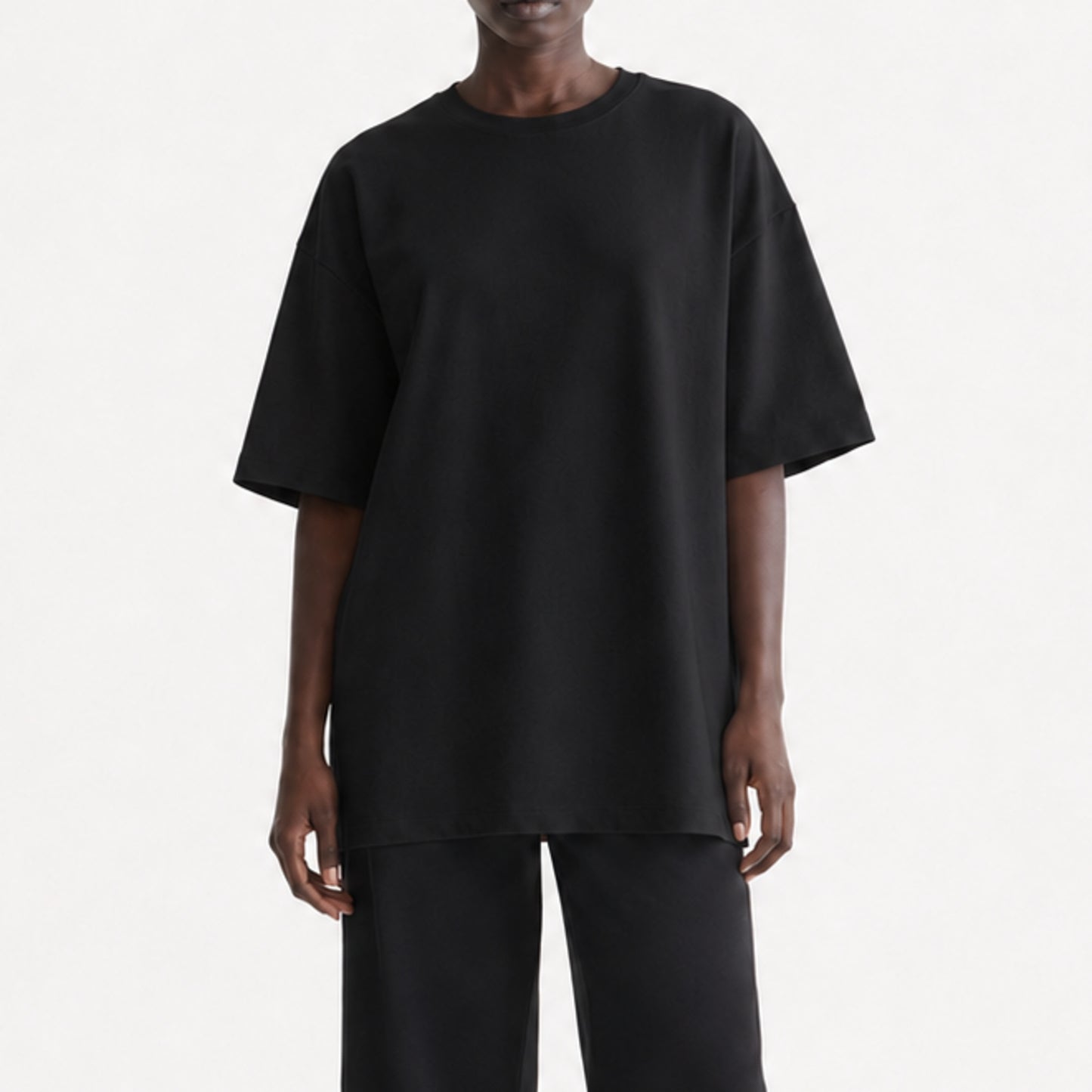 FineAF Black heavyweight T-shirt, cropped torso view showing dropped shoulders and straight hem