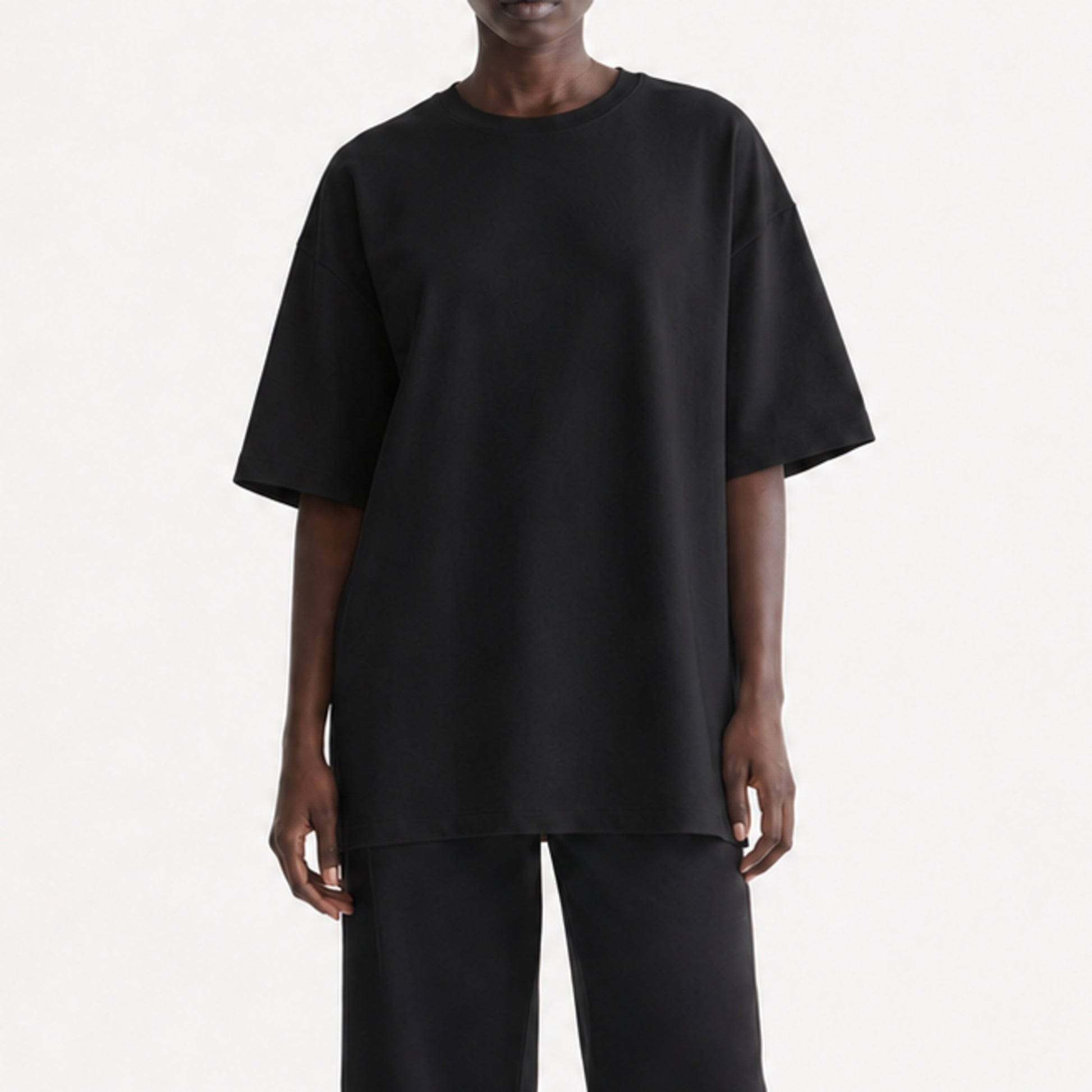 FineAF Black heavyweight T-shirt, cropped torso view showing dropped shoulders and straight hem