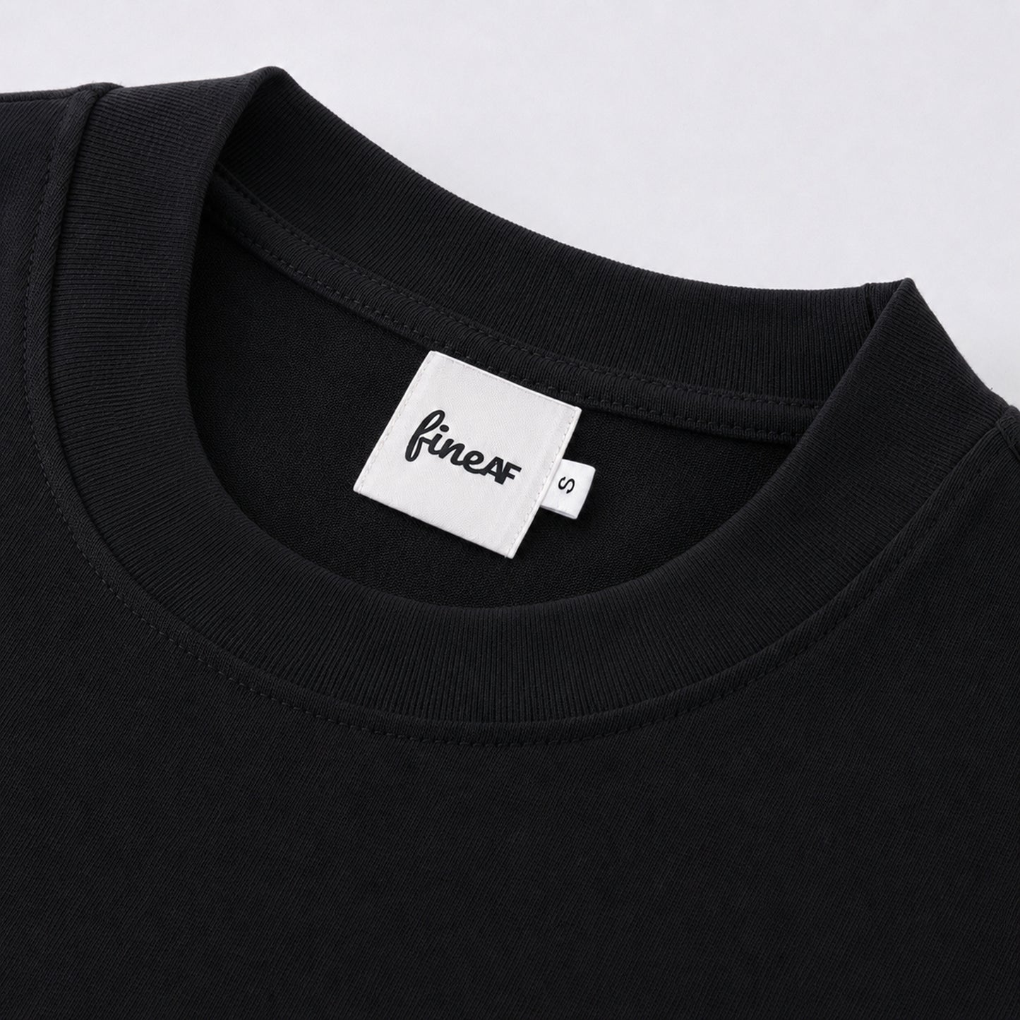 FineAF Black heavyweight T-shirt neckline and FineAF label detail