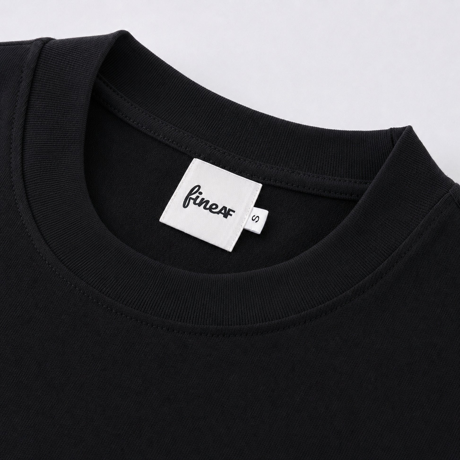 FineAF Black heavyweight T-shirt neckline and FineAF label detail