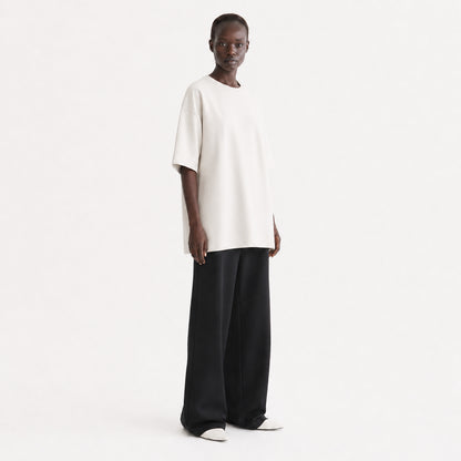 FineAF Collection One heavyweight drop-shoulder T-shirt in Oat, three-quarter view on model