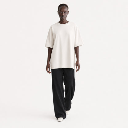 FineAF Collection One heavyweight drop-shoulder T-shirt in Oat, movement pose on model