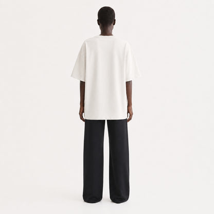 FineAF Collection One heavyweight drop-shoulder T-shirt in Oat, back view on model