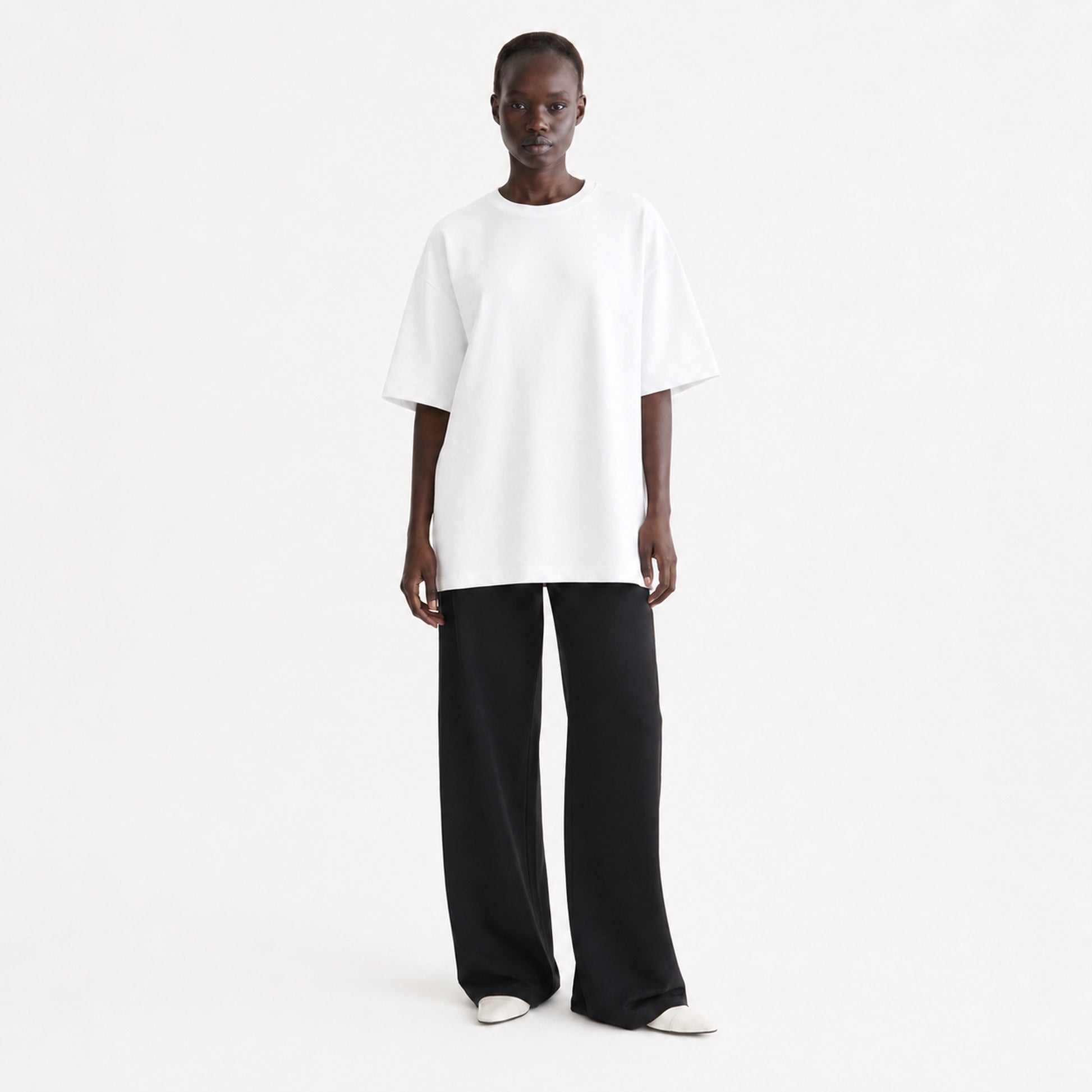 FineAF Collection One heavyweight drop-shoulder T-shirt in White, front view on model