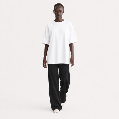 FineAF Collection One heavyweight drop-shoulder T-shirt in White, movement pose on model