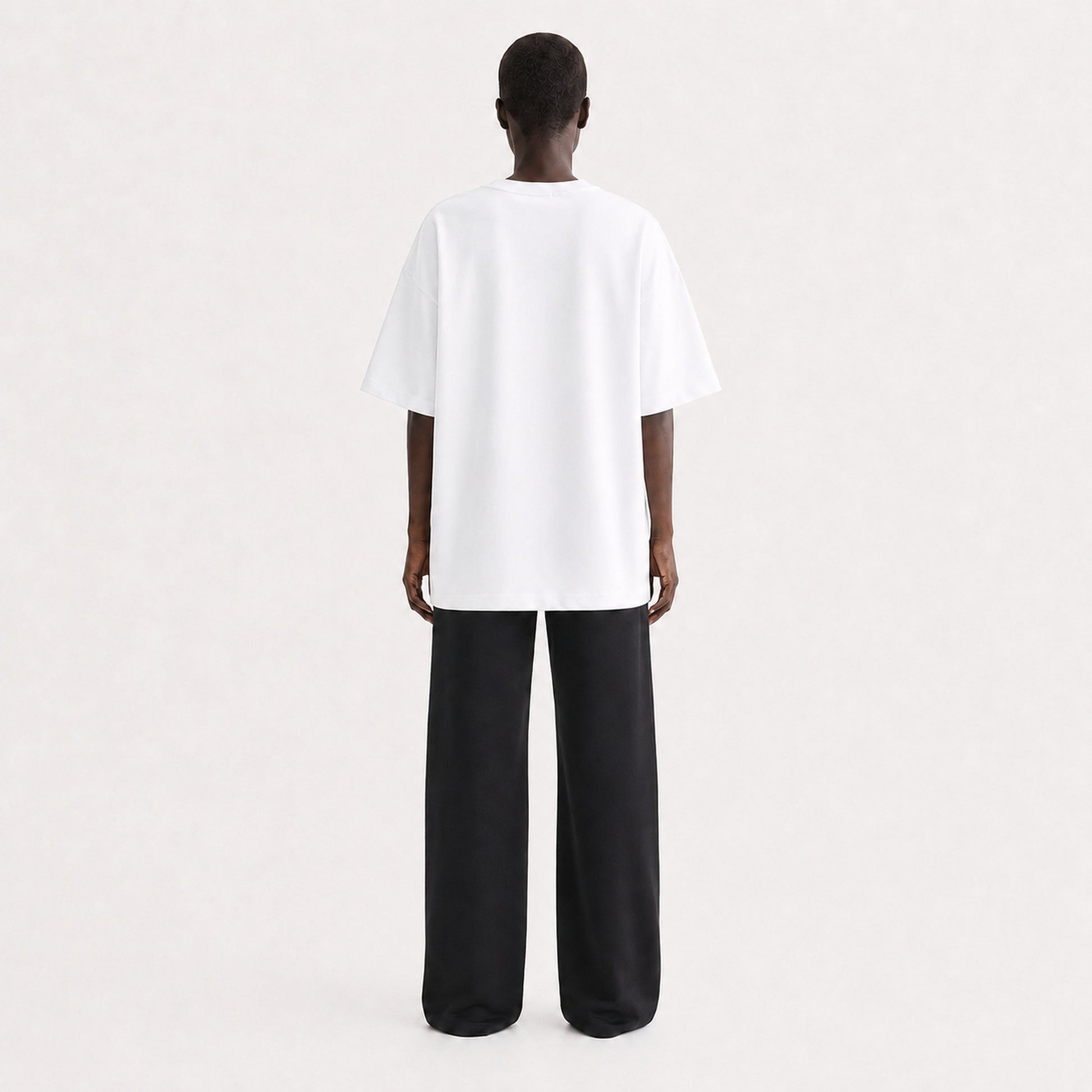 FineAF Collection One heavyweight drop-shoulder T-shirt in White, back view on model