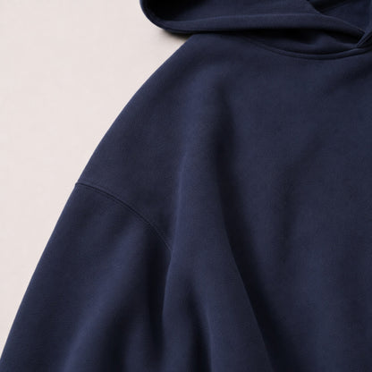 Close-up of the FineAF Electric hoodie dropped shoulder seam and heavyweight navy fleece