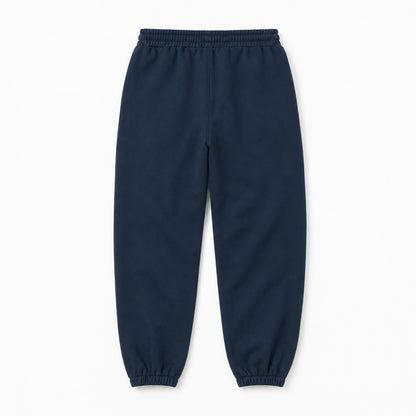 Back flat lay of FineAF Electric deep navy pants showing the clean pocket-free back and tapered elastic ankles.