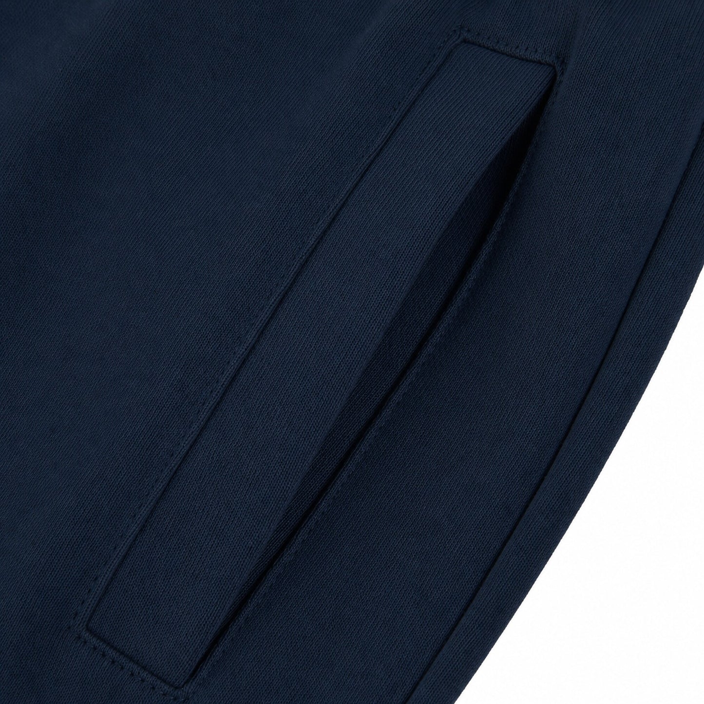 Close-up of the long vertical welt pocket and tonal stitching on FineAF Electric deep navy pants.