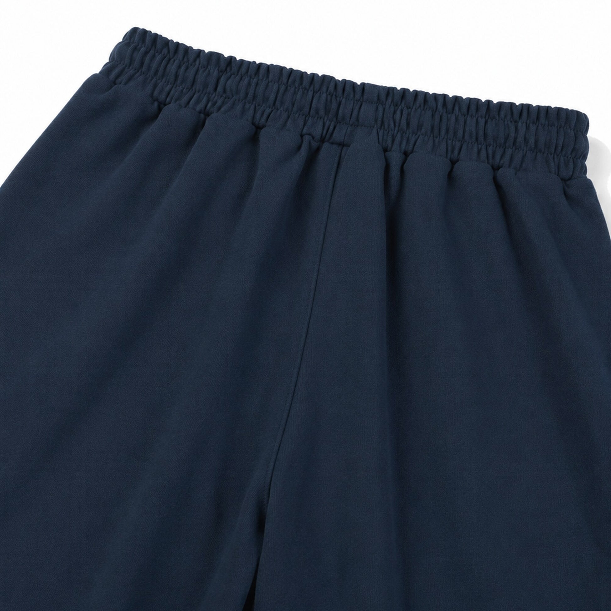 Close-up of the gathered rear waistband and single center-back rise seam on FineAF Electric navy pants.