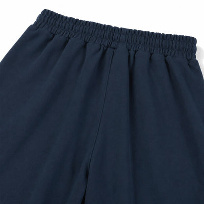 Close-up of the gathered rear waistband and single center-back rise seam on FineAF Electric navy pants.