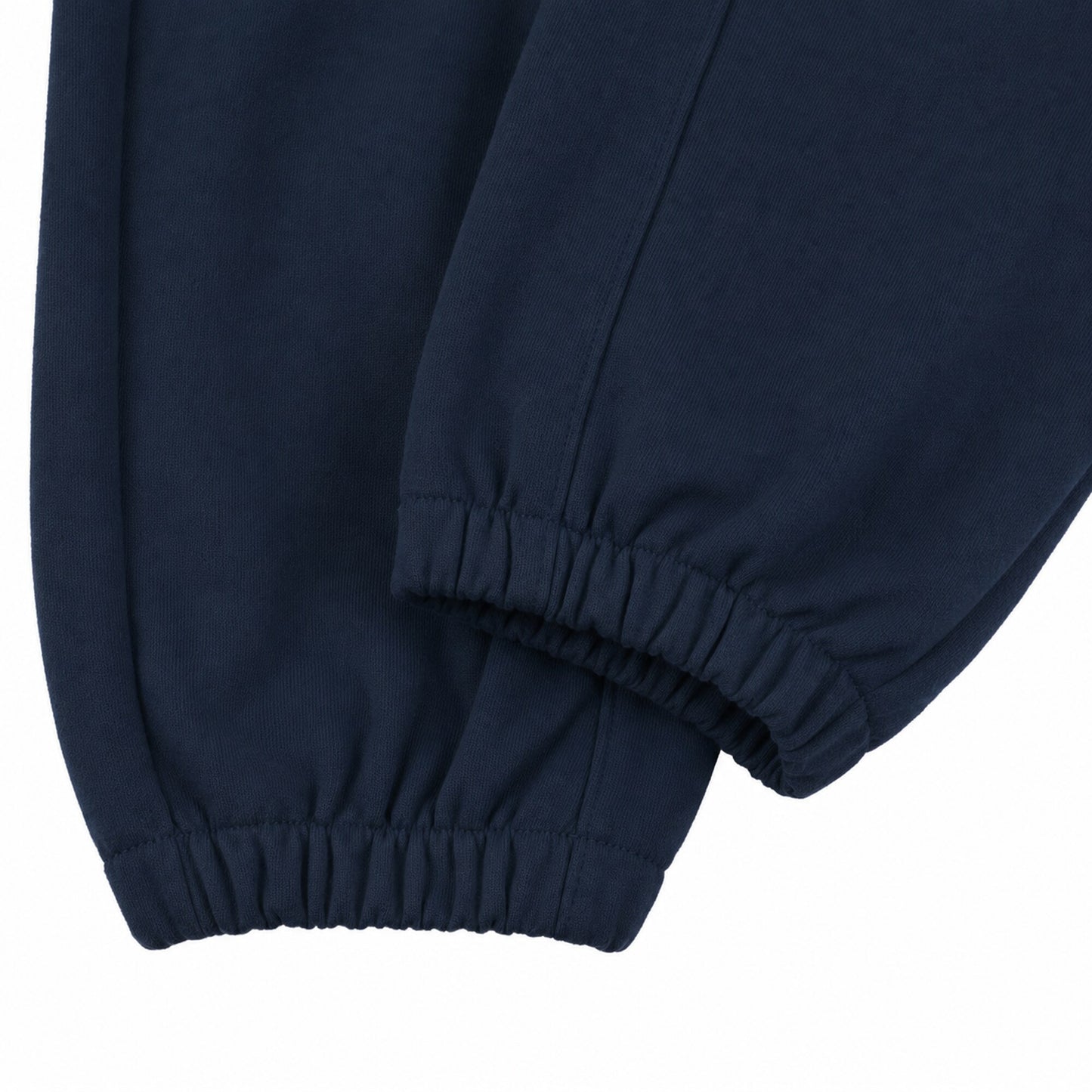 Close-up of the narrow gathered elastic ankle construction on FineAF Electric deep navy pants.
