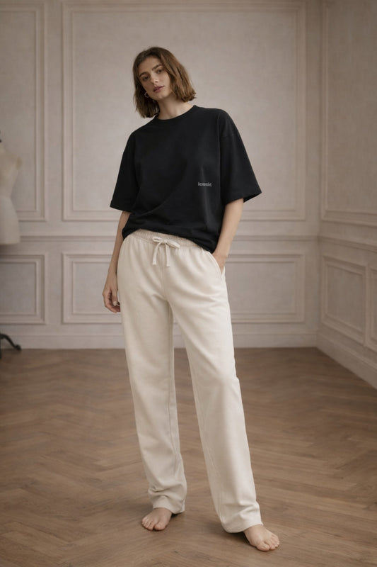 Ivory FineAF jogger sweatpants, full-body lifestyle photo on model from the front.