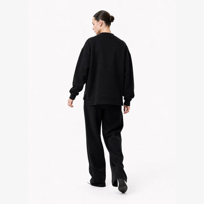 Moving back view of the FineAF Iconic black oversized crewneck sweatshirt with a clean unprinted back.