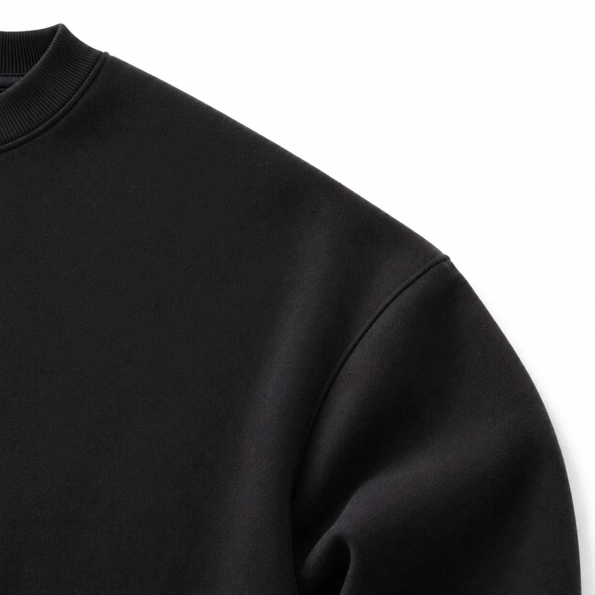 Close-up of the FineAF Iconic black sweatshirt extreme dropped-shoulder construction and heavyweight fleece.