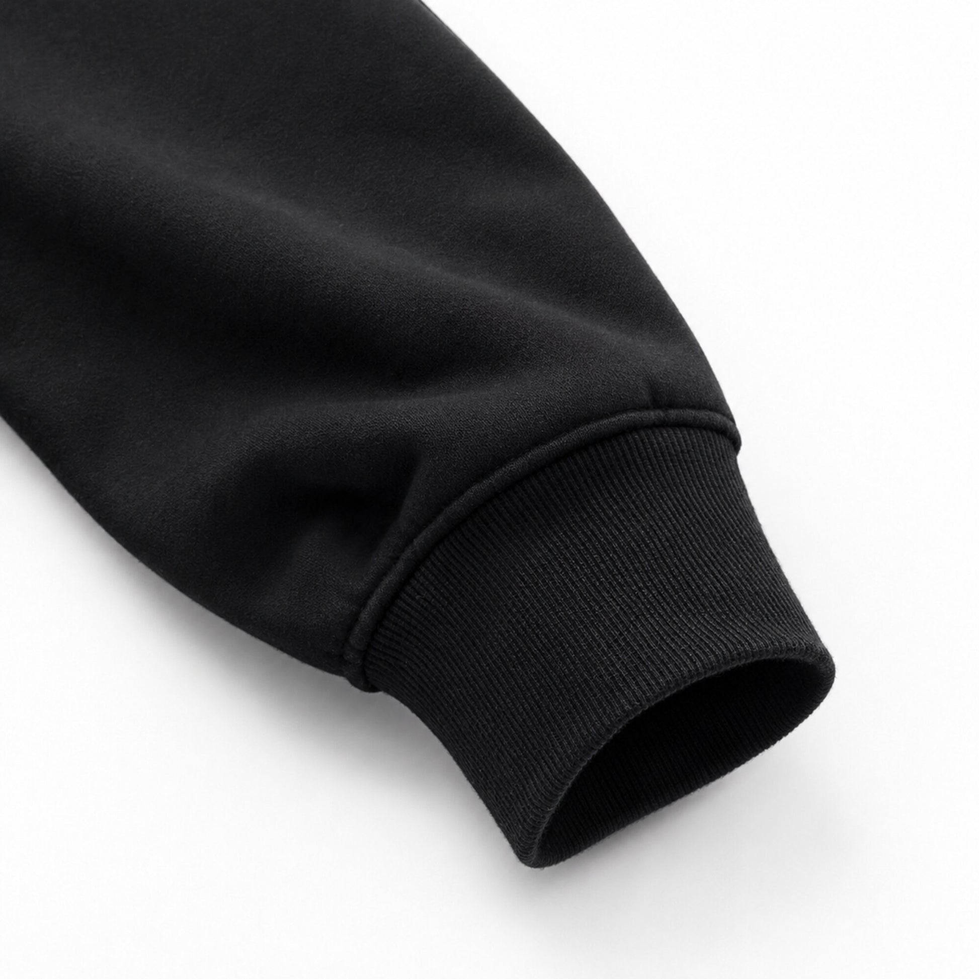 Close-up of the FineAF Iconic black sweatshirt heavyweight sleeve and dense ribbed cuff.