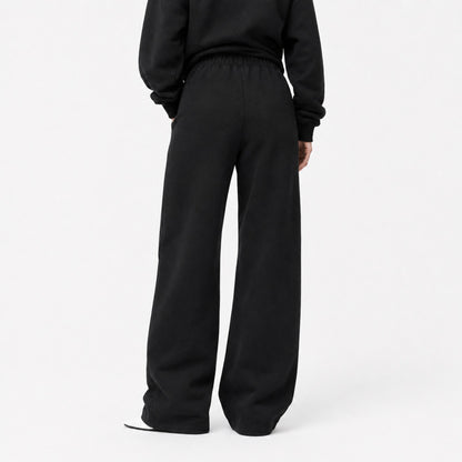 Back view of FineAF Iconic black oversized straight-leg pants with a clean pocket-free back