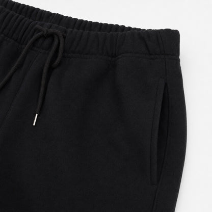 Close-up of the FineAF Iconic black pants elastic waistband drawcord and slanted side pocket