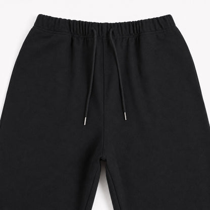 Close-up of the FineAF Iconic black pants front rise seam waistband and upper leg construction