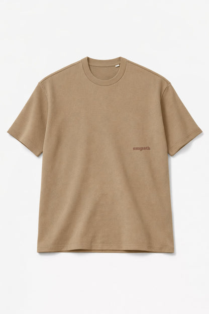 Beige FineAF crewneck T-shirt, studio front view cropped showing chest logo placement.