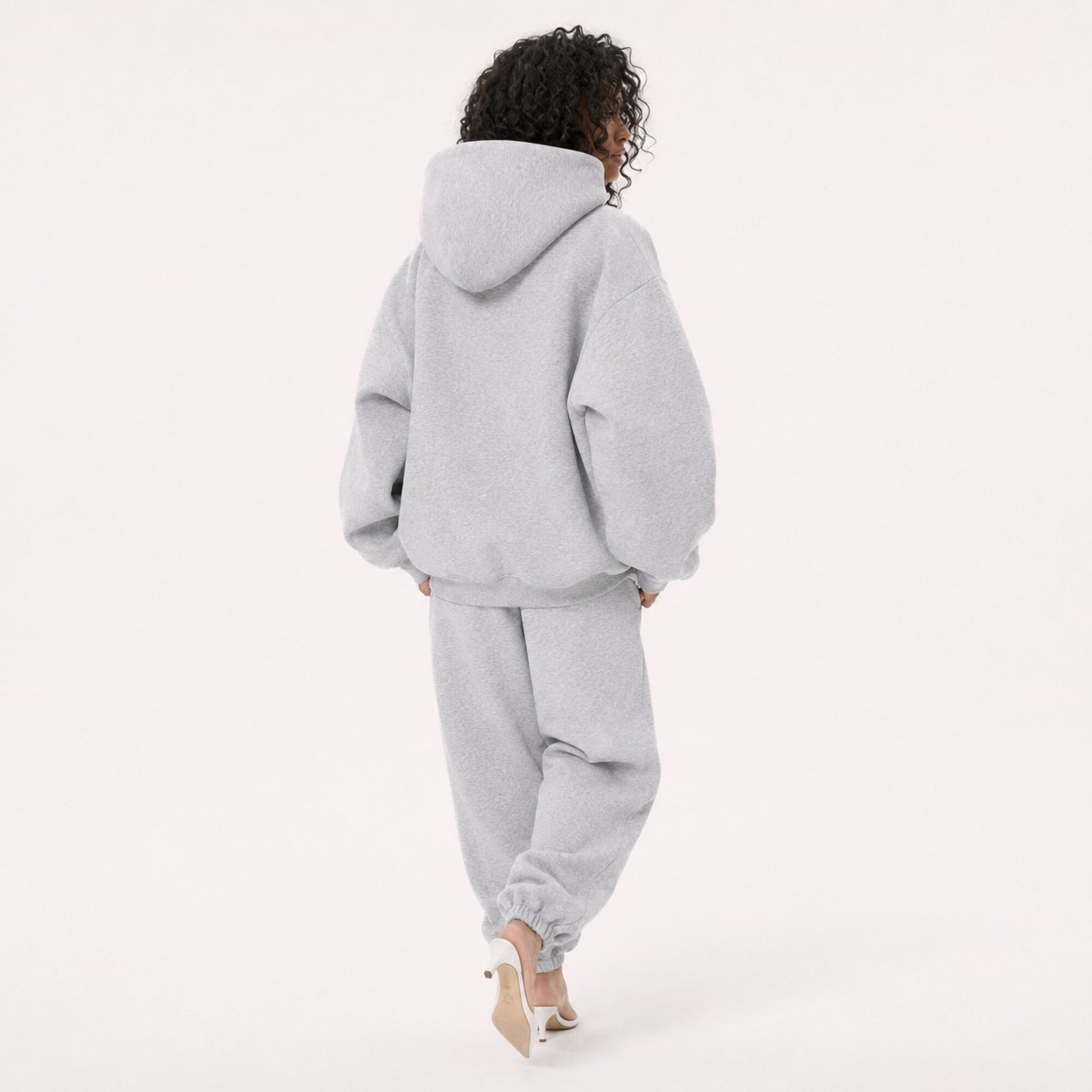 Moving back view of the FineAF Magnetic heather grey hoodie with a clean back and structured hood