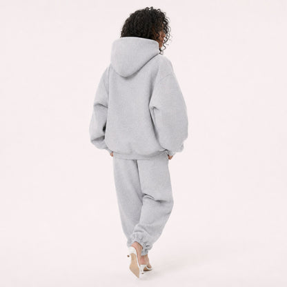 Moving back view of the FineAF Magnetic heather grey hoodie with a clean back and structured hood