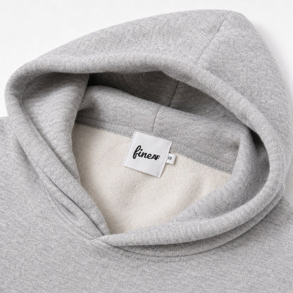 Close-up of the FineAF Magnetic hoodie interior, brushed fleece, white FineAF neck label and size tab