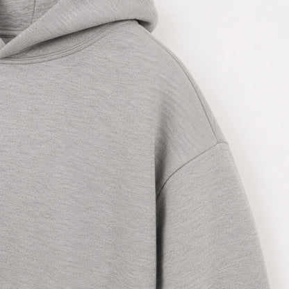 Close-up of the dropped shoulder seam on the FineAF Magnetic heather grey hoodie