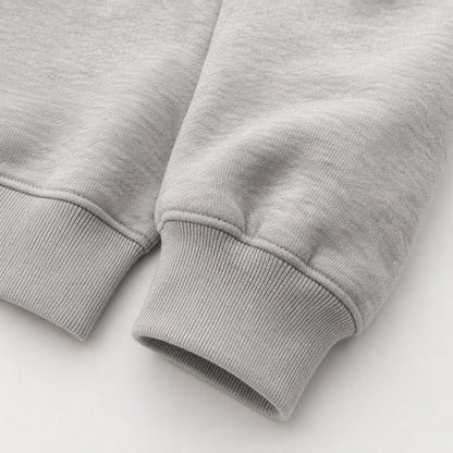 Close-up of the heavyweight sleeve and ribbed cuff on the FineAF Magnetic heather grey hoodie