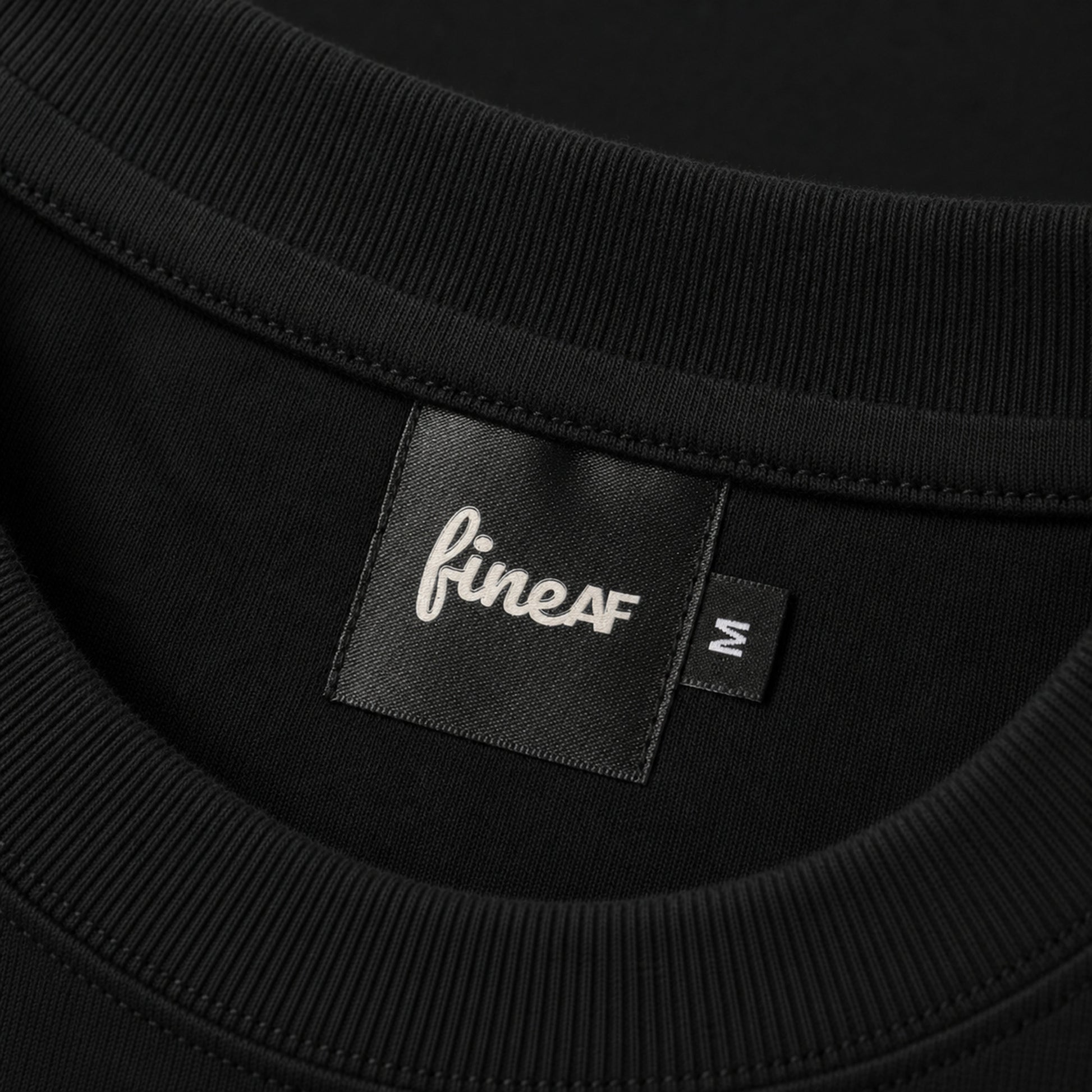 Black FineAF Boxy Tee ribbed neckline and woven inside neck label