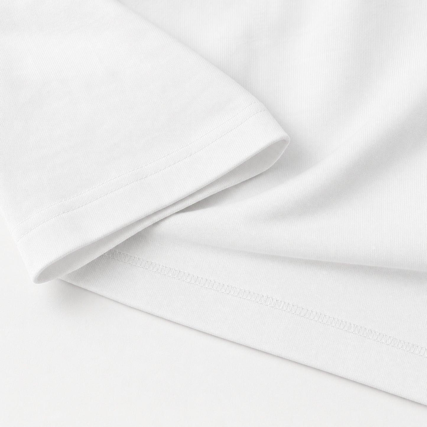 White FineAF Boxy Tee sleeve hem stitching and heavy cotton jersey detail