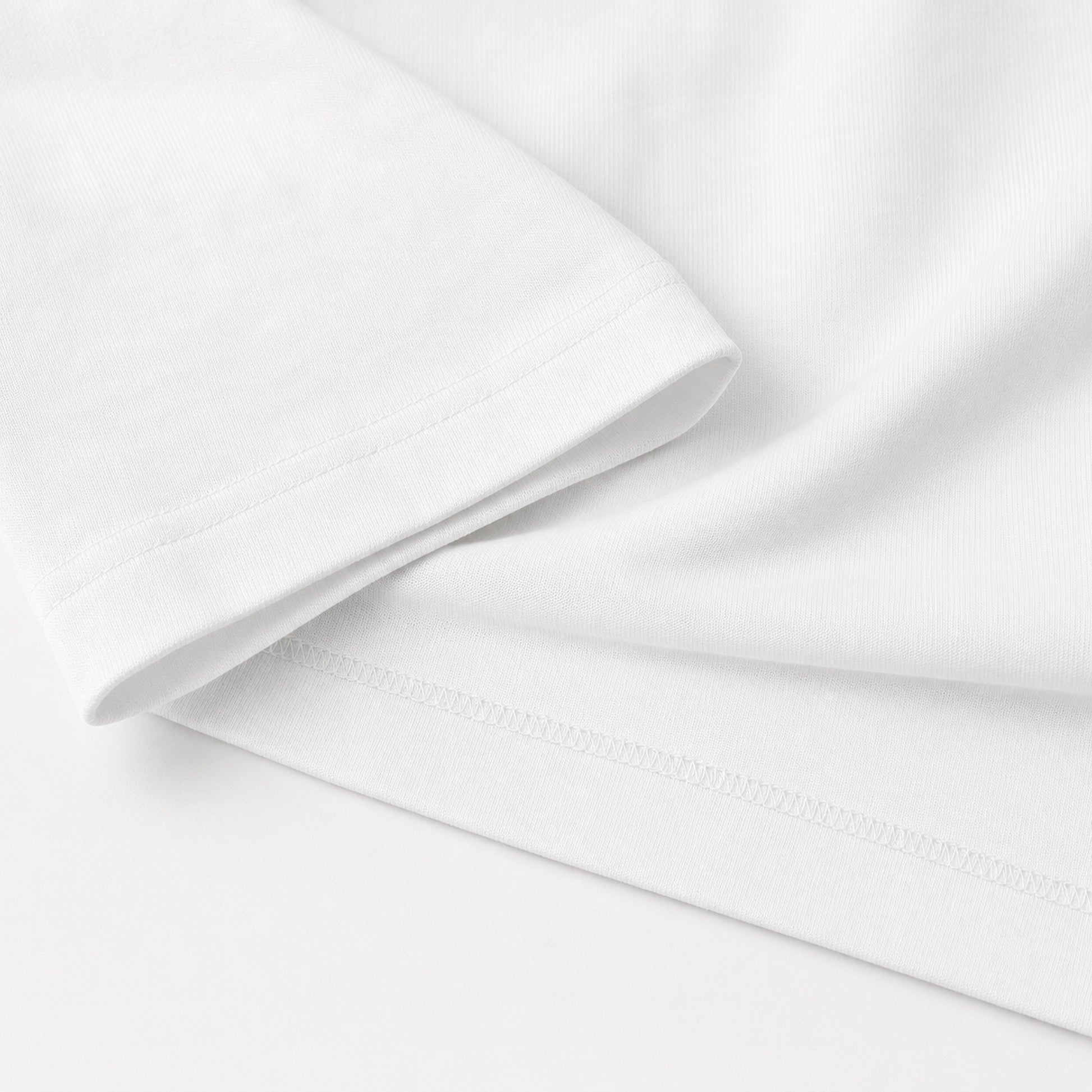White FineAF Boxy Tee sleeve hem stitching and heavy cotton jersey detail