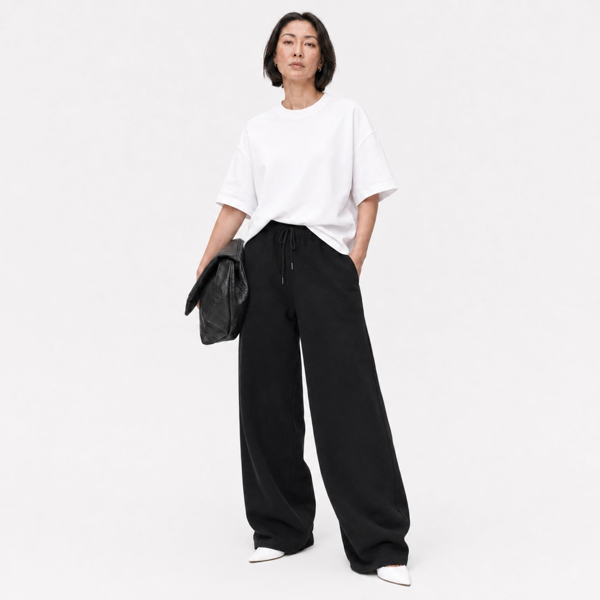 White FineAF Boxy Tee styled with black wide-leg pants, full-length editorial view