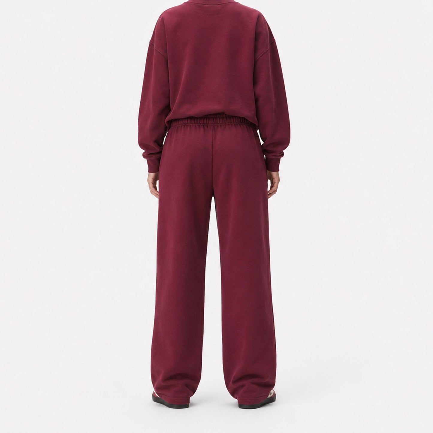 Back view of oversized FineAF Visionary wine pants showing the clean seat, gathered waistband and straight legs.