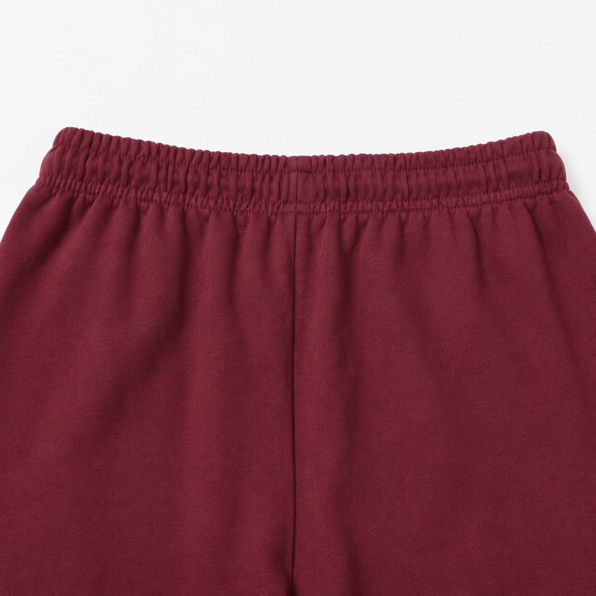 Close-up of the FineAF Visionary wine pant back waistband and centre-back rise seam.