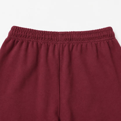 Close-up of the FineAF Visionary wine pant back waistband and centre-back rise seam.